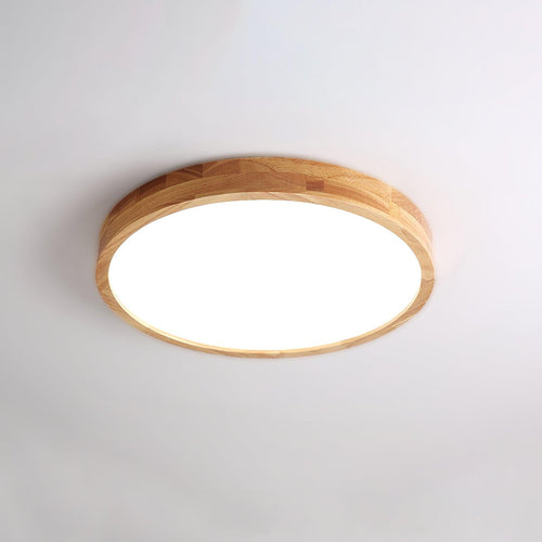 Slim rubberwood ceiling light mounted flush to a ceiling