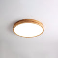 Wooden geometric ceiling light glowing in a modern room