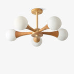 Photographed front-on and cropped close, this Clérachic chandelier's five opal glass globes sit symmetrically on their pale wood arms.