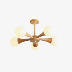 Rotated to show three globes forward, this Clérachic chandelier's pale wood arms sit unlit on a plain white background.