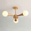 Viewed from below on a plain backdrop, this Clérachic chandelier's five opal globes sit unlit on their pale wood arms.