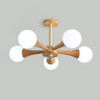 Unlit on a plain grey background, this Clérachic chandelier's opal glass globes appear bright white against the pale wood arms.