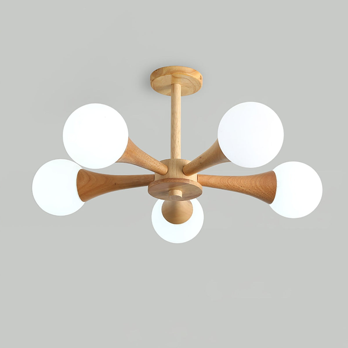 Unlit on a plain grey background, this Clérachic chandelier's opal glass globes appear bright white against the pale wood arms.