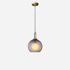 Glass pendant light styled in a warm, modern interior