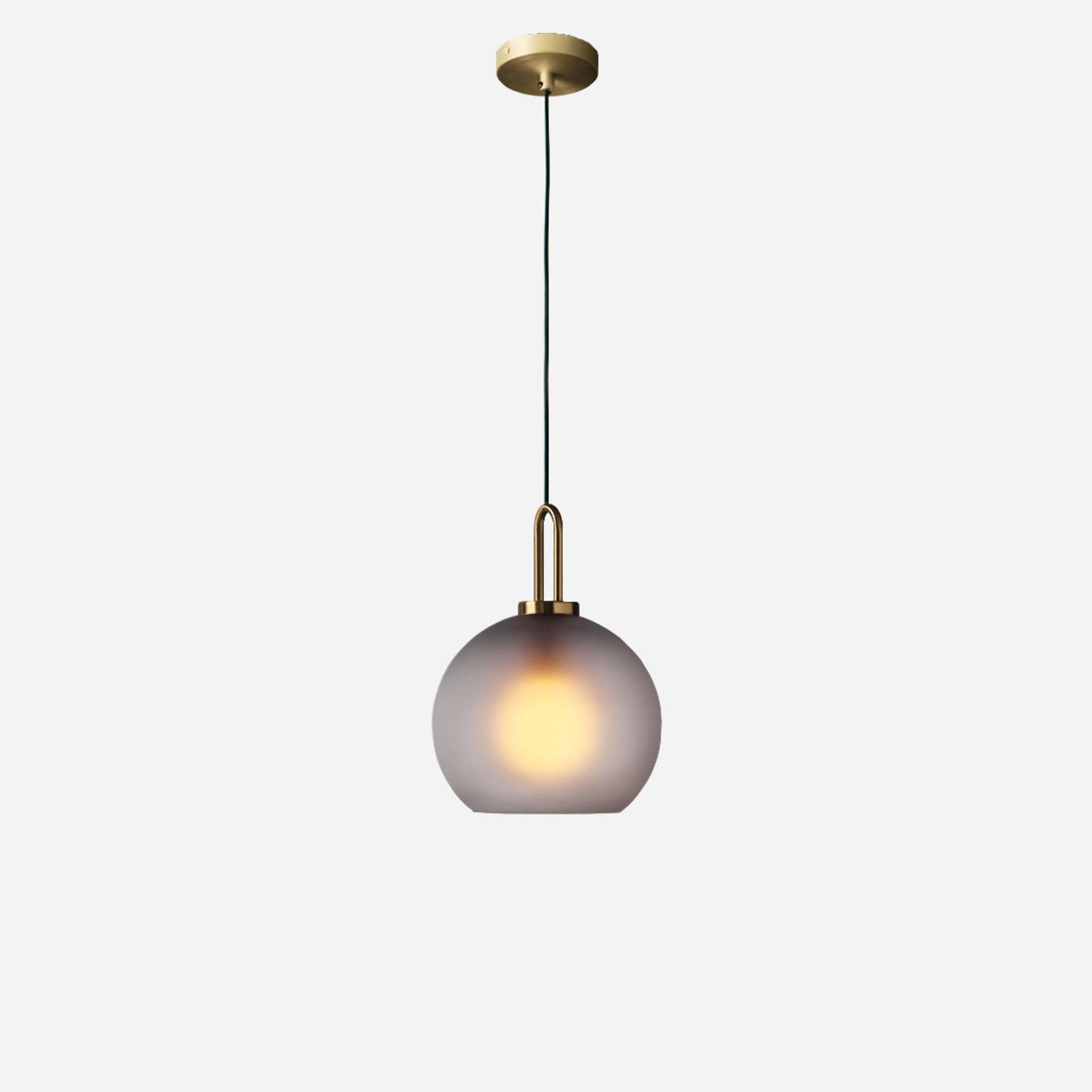 Glass pendant light styled in a warm, modern interior