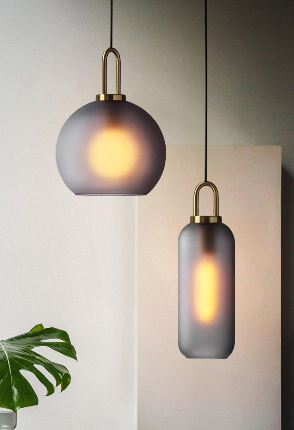 Glass pendant light with copper-plated body and clear glass shade