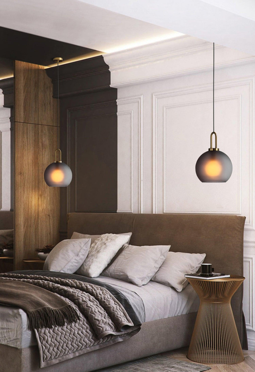Glass pendant light showing the glowing filament bulb inside