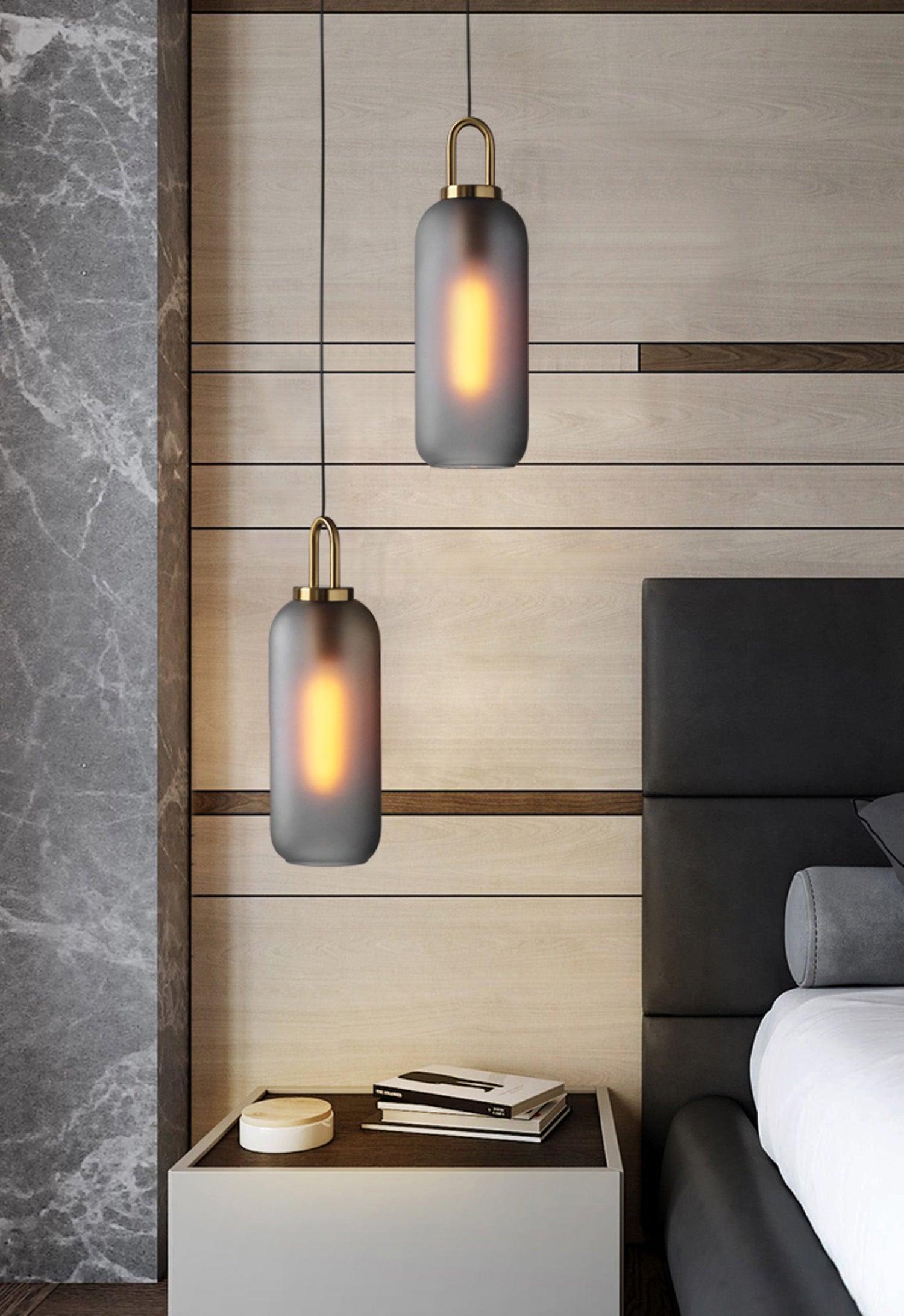 Glass pendant light cluster at mixed cable lengths over a table