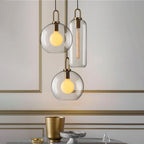 Glass pendant light hanging in a styled interior with warm light