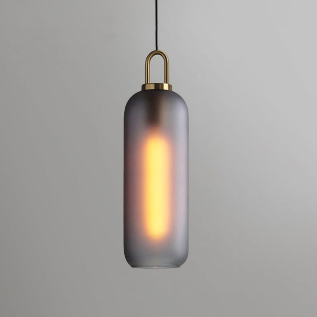 Frosted smoke-gray glass pendant light with warm glow, 15 cm