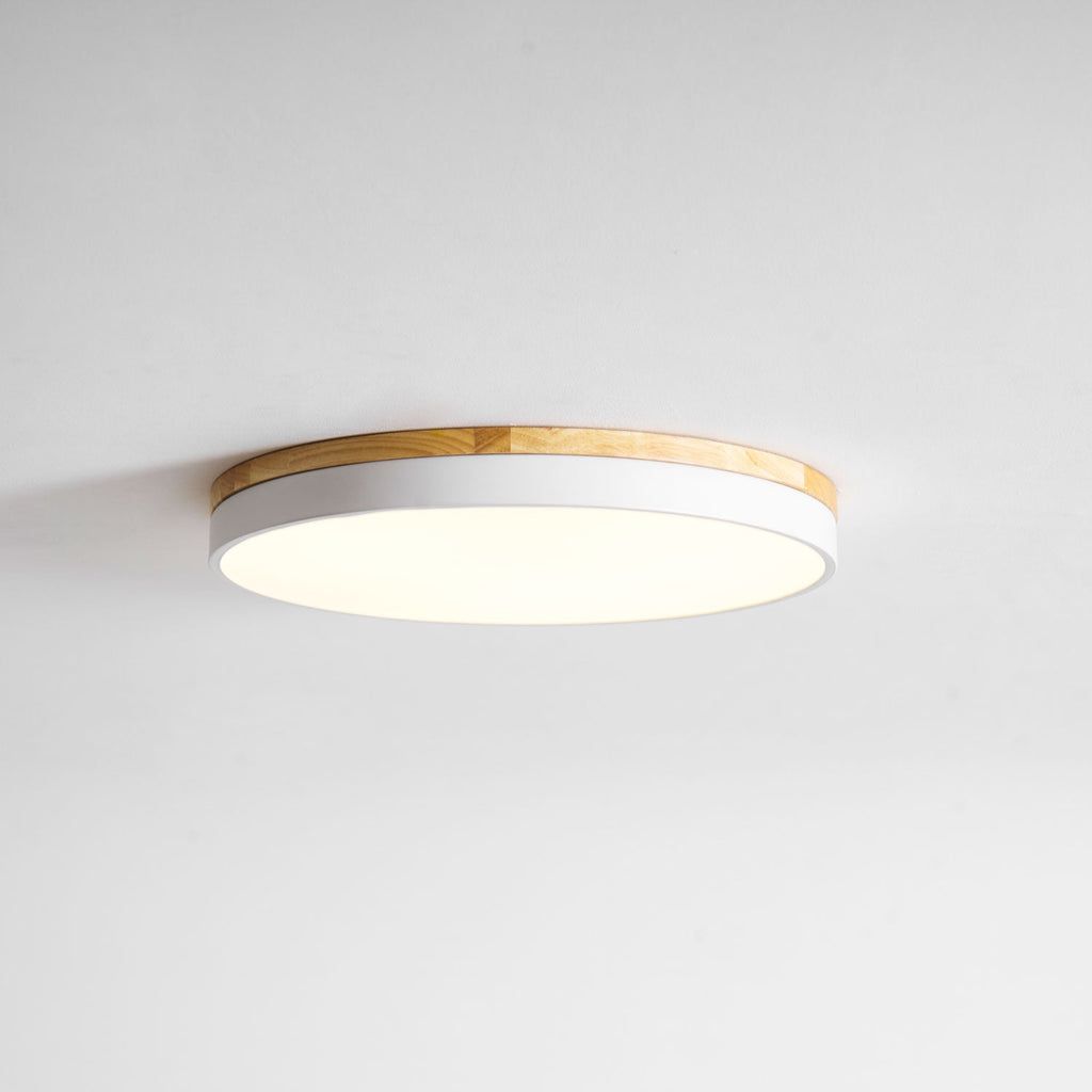 Circular wood ceiling lamp from below highlighting even illumination