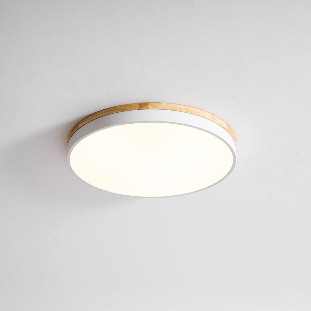 Circular wood ceiling lamp showing its low-profile flush mount design