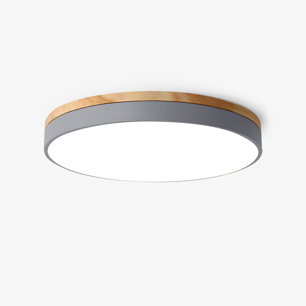 Circular wood ceiling lamp shown flush against a bedroom ceiling