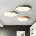 Circular wood ceiling lamp installed above a dining area