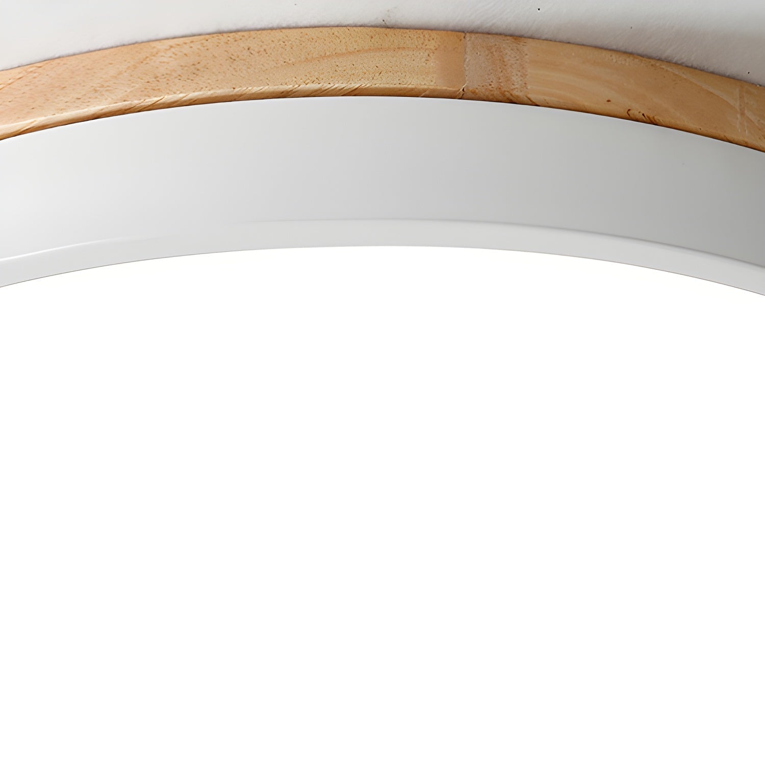 Circular wood ceiling lamp glowing softly in a modern room at dusk