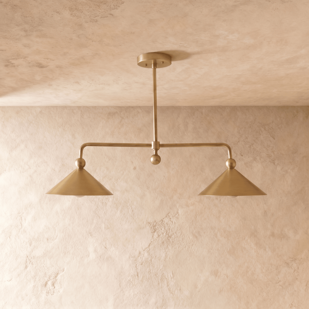 Clérachic chandelier in satin brass, close front-on view of the two angled cone shades and center rod.