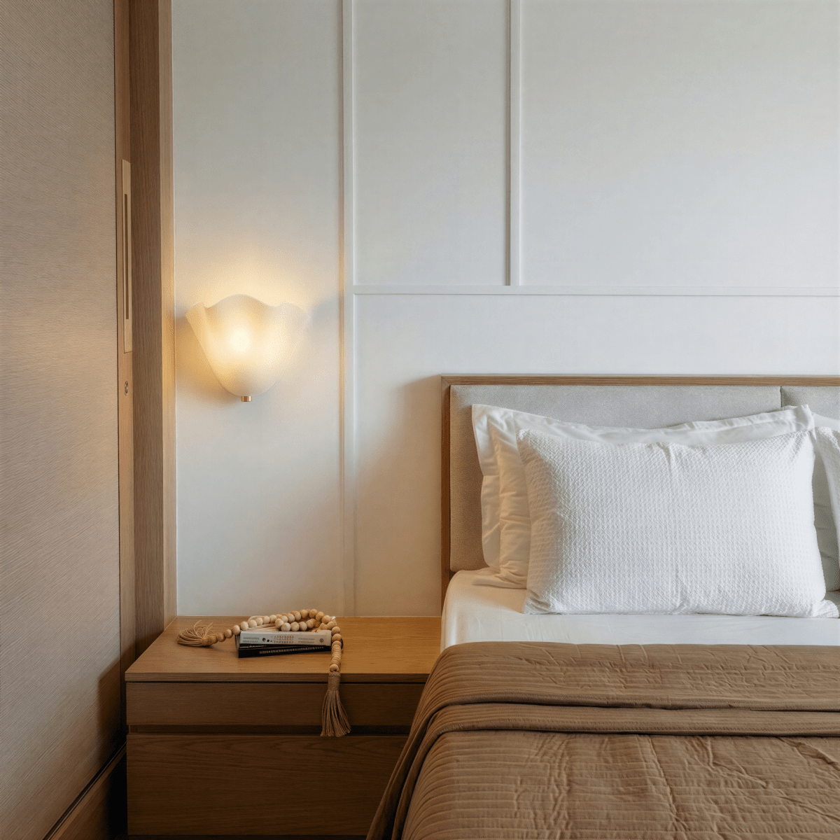 Clérachic glass wall light in red, the fold catching light along its crease
