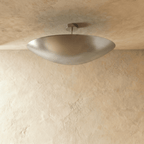 Clérachic ceiling light in chrome, the elongated bowl shade shown from another angle below the ceiling.