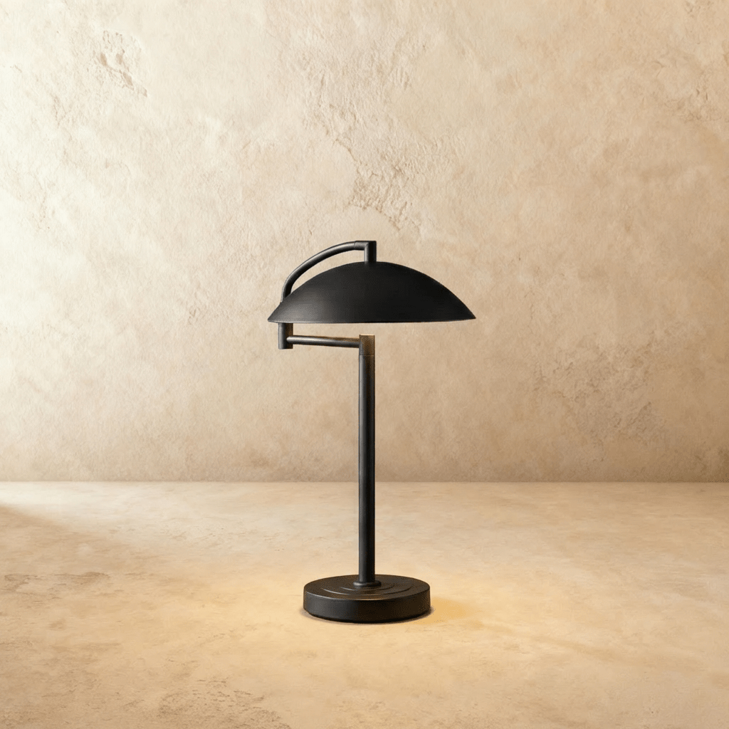 Clérachic dome table lamp in matte black, standing on its round, ringed base against a plain studio backdrop.
