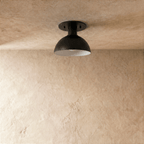 Clérachic ceiling light in matte black, close front view of the domed shade and round canopy.