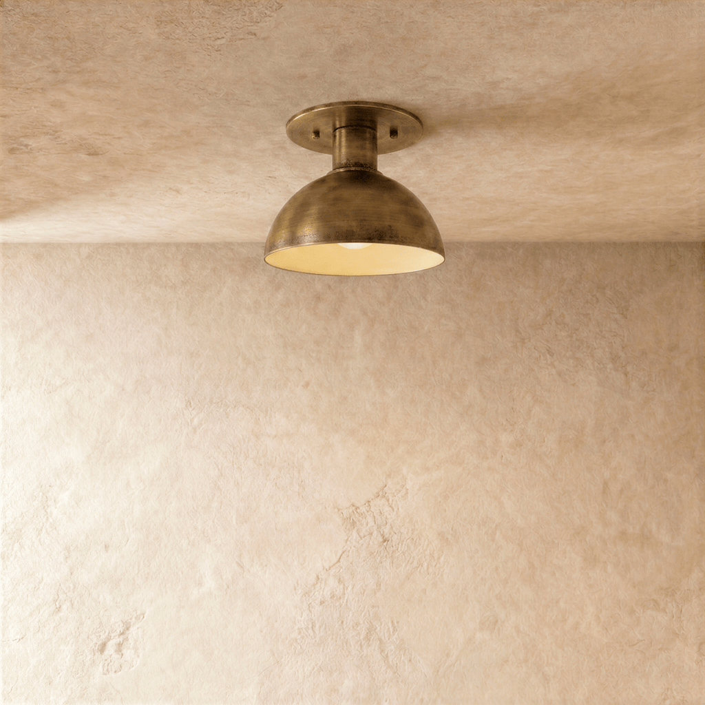 Clérachic ceiling light in vintage brass, a domed metal shade mounted flush against a plaster ceiling.