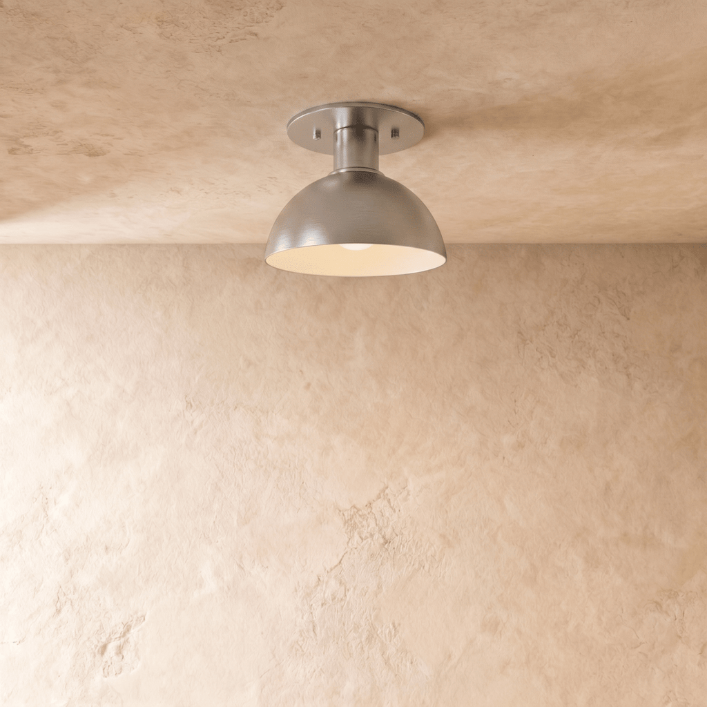 Clérachic ceiling light in chrome, a rounded dome shade mounted flush against a plaster ceiling.