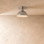 Clérachic ceiling light in chrome, a rounded dome shade mounted flush against a plaster ceiling.
