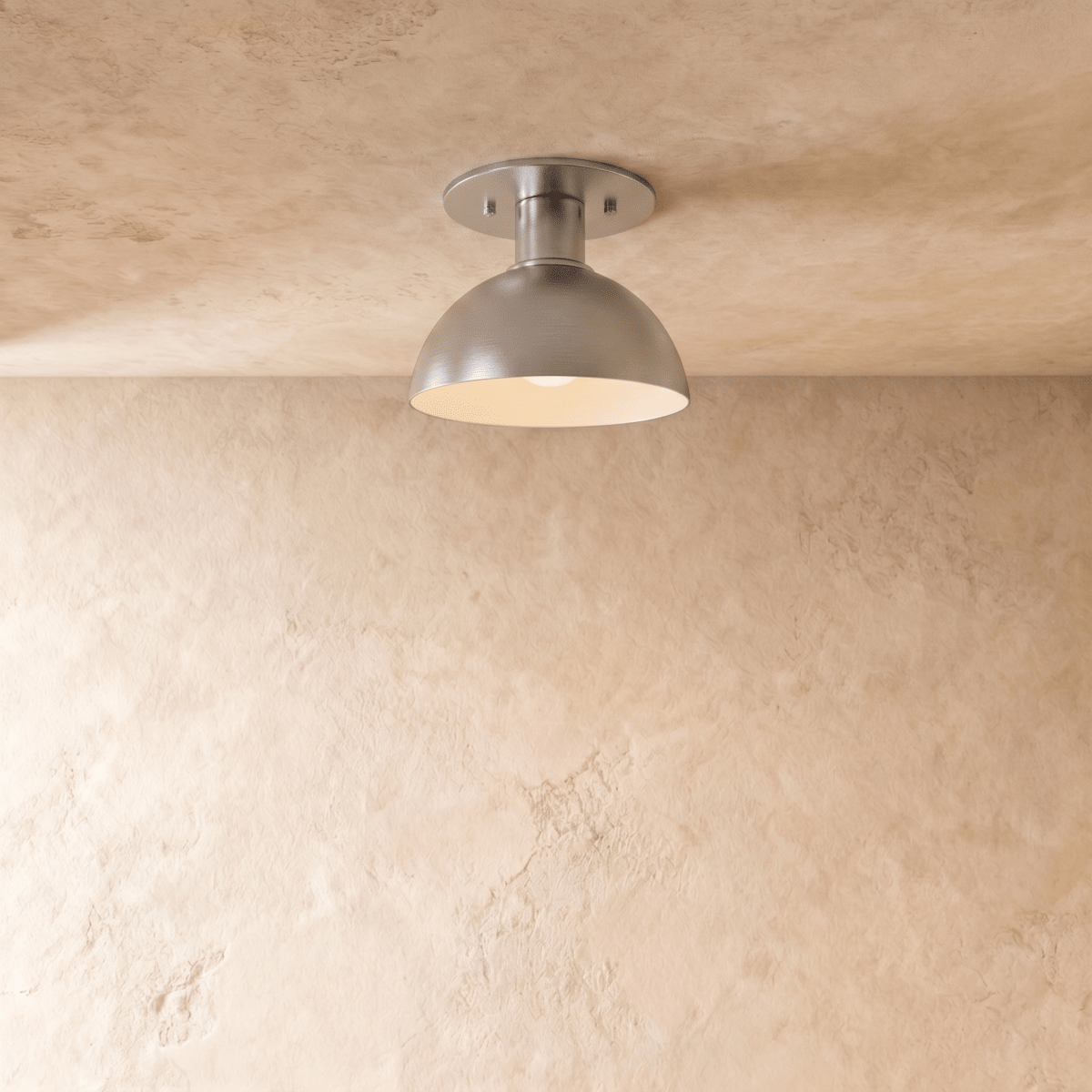 Clérachic ceiling light in chrome, a rounded dome shade mounted flush against a plaster ceiling.