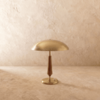 Clérachic table lamp in polished brass, the dome shade and walnut stem shown from another angle.