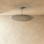 Clérachic pendant light in chrome, front view of the fluted disc shade and slim ceiling rod.
