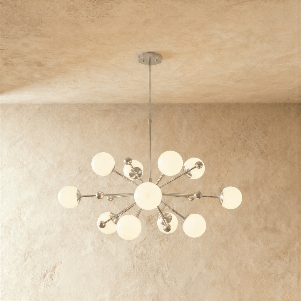 This Clérachic chandelier in chrome, a sputnik burst of opal glass globes on slender arms.