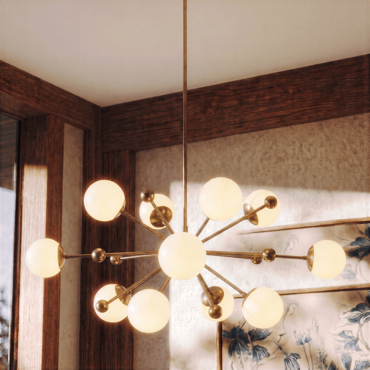 Clérachic chandelier in vintage brass glowing in a wood-paneled dining room with floral wallpaper.