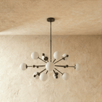 Clérachic chandelier in matte black shown from another angle, globes radiating from a central sphere.