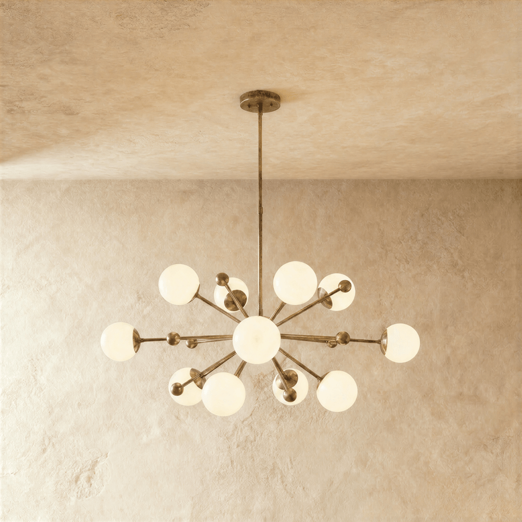 Clérachic chandelier in vintage brass, a sputnik burst of opal glass globes on slender arms.