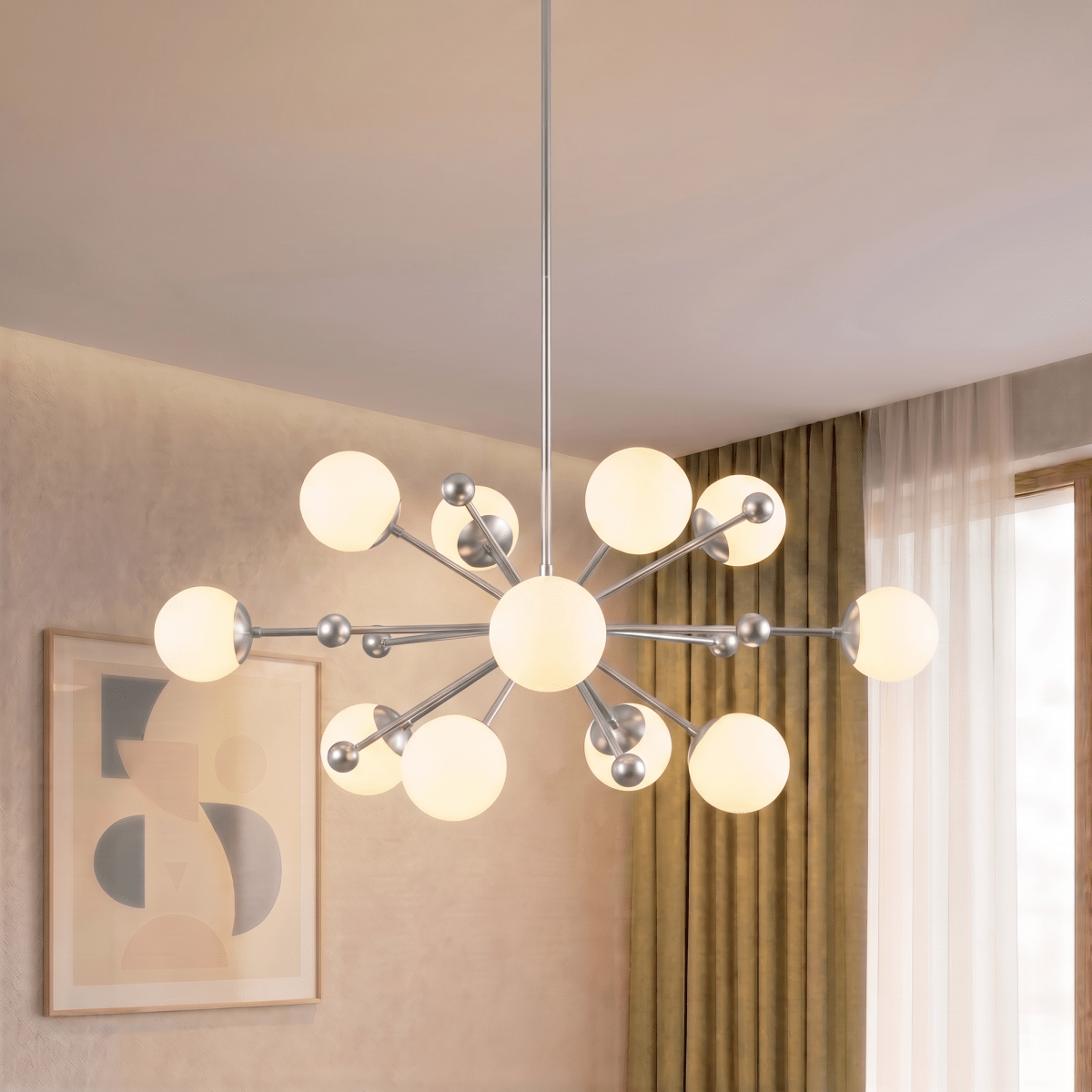Clérachic chandelier in chrome lighting a living room corner beside sheer curtains and framed art.