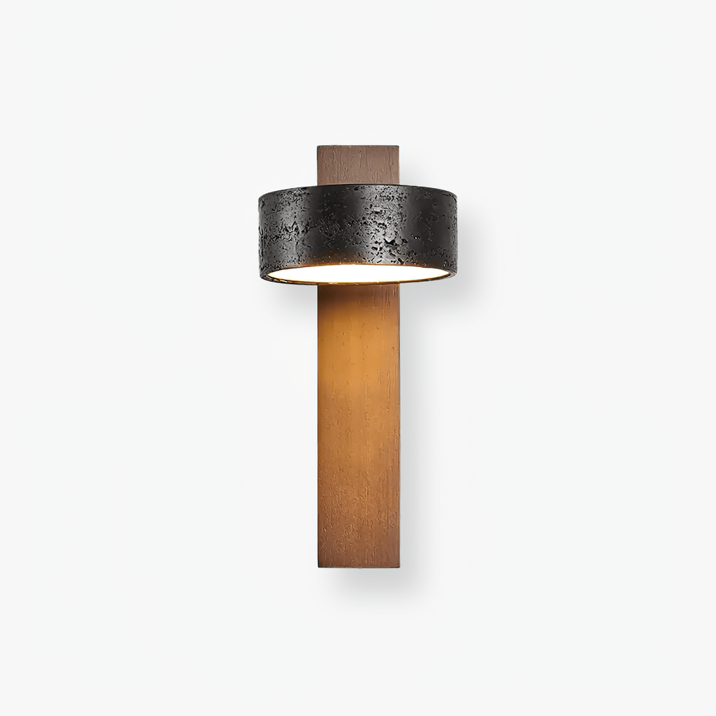 Product shot of this Clérachic wall light on white, its black travertine drum sitting above a walnut wood bar.