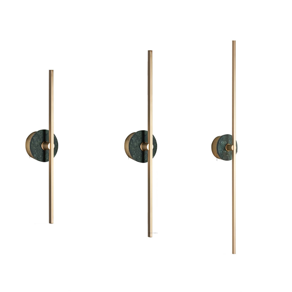 Three Clérachic wall sconce units lined up on white, each fitted with a green stone disc at a different height.