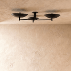 Clérachic ceiling light in matte black, close front view of the three angled shades and arms.