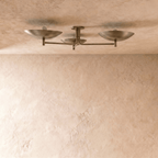 Clérachic ceiling light, front view of the three angled shades branching from a round ceiling canopy.