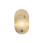 The sconce shown straight on and lit against white, alabaster glowing through the oval opening.