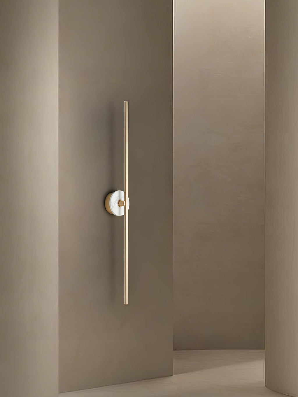Clérachic wall sconce mounted in a narrow taupe hallway corner, its stone disc sitting just beside an open doorway.