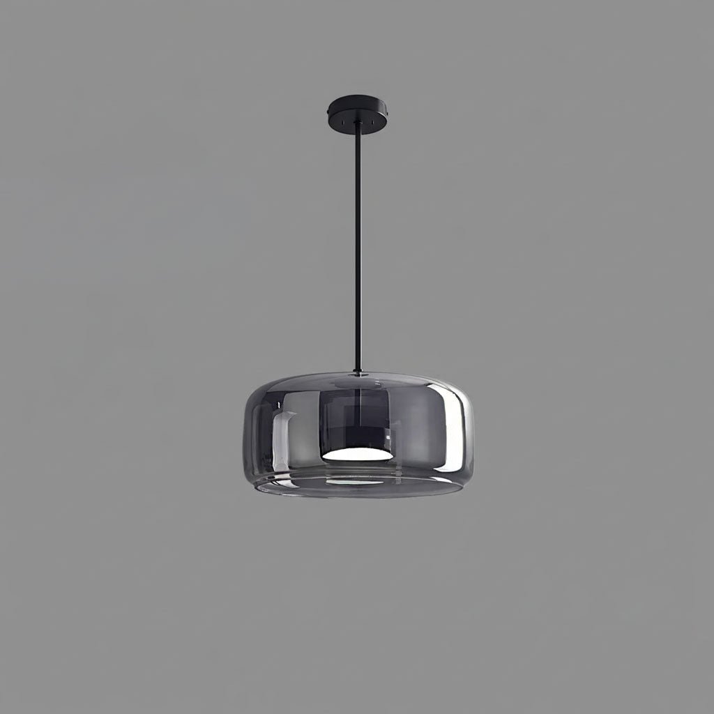 Hand-blown glass pendant light hanging from a slim ceiling rod
