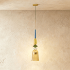 Clérachic pendant light with a fluted amber glass bell shade flaring at the hem, its stem beaded in green, gold and blue glass.