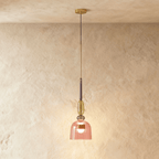 Clérachic pendant light with a ribbed rose-pink glass bell shade under a smoky grey bead, an olive-gold oval and a deep plum glass neck.