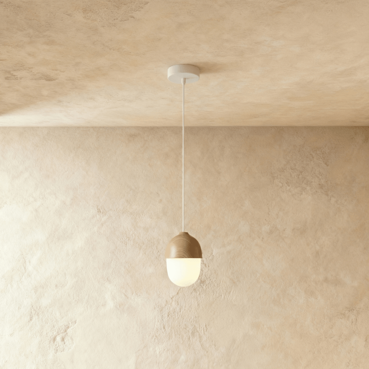 Clérachic acorn pendant in the taller shape, hanging on a white flex