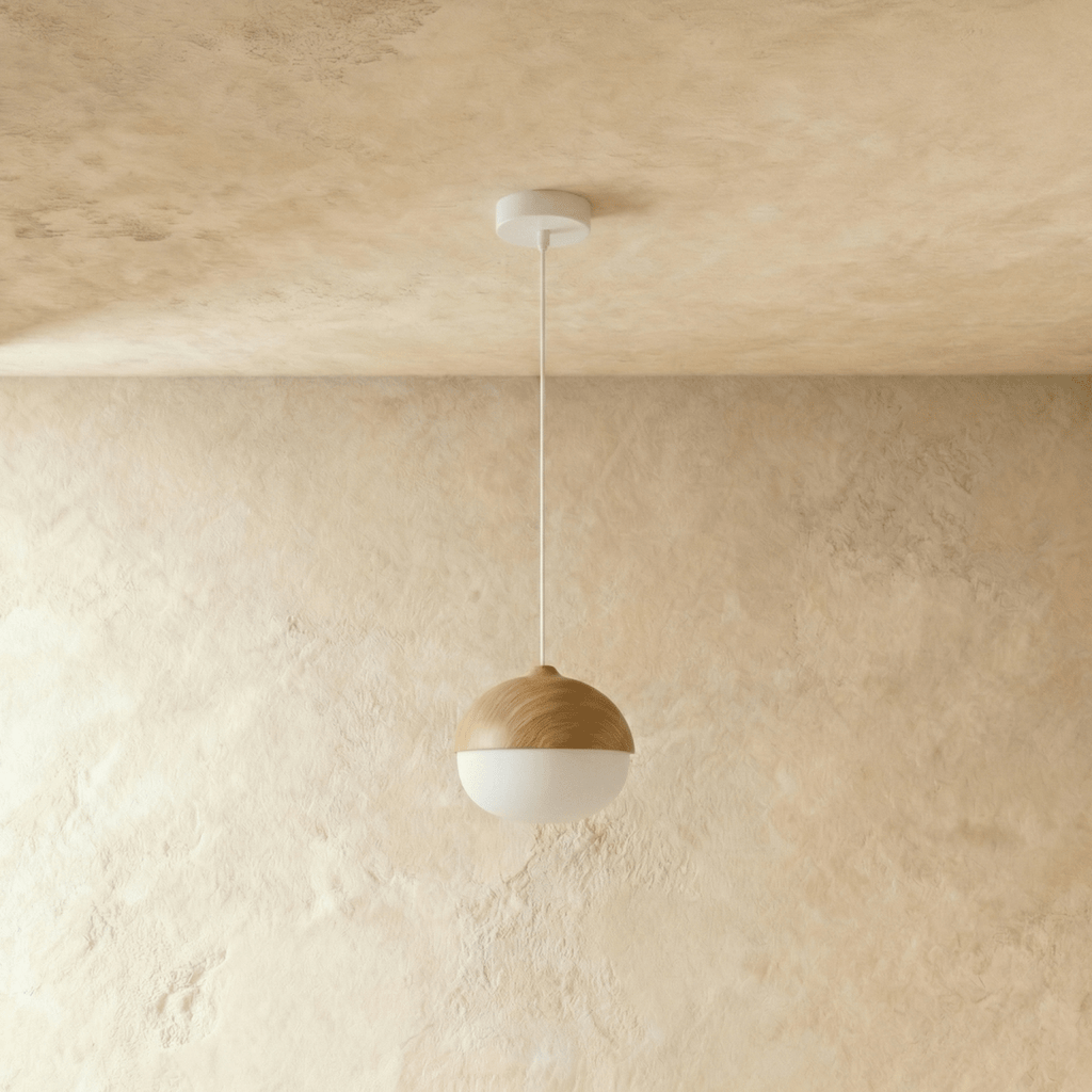 Clérachic acorn pendant seen straight on, wood grain running across the cap