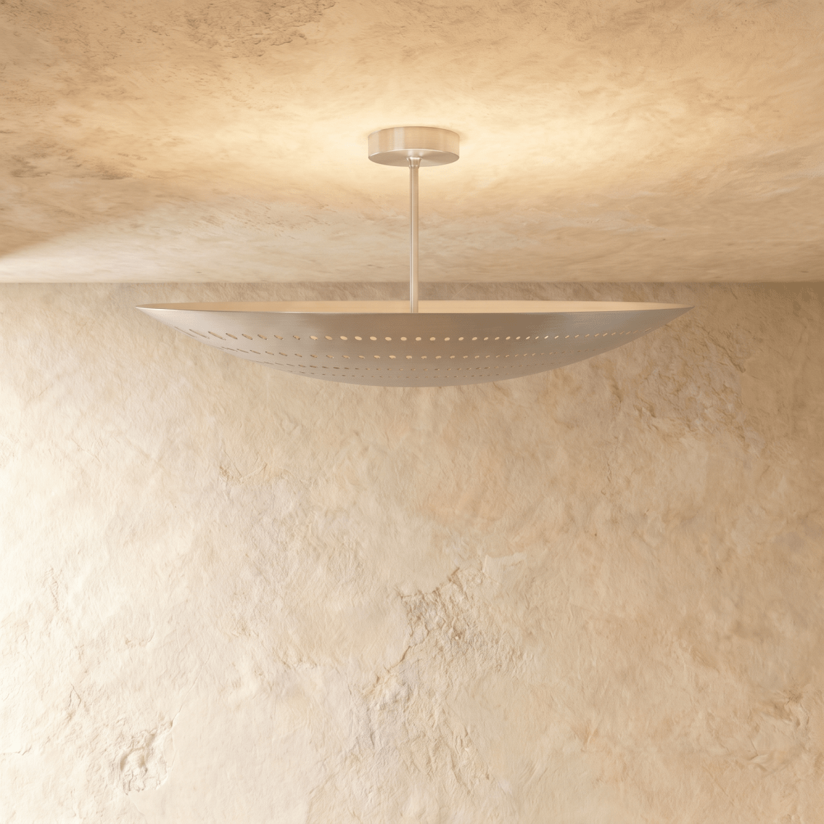 Clérachic ceiling light in chrome, a curved boat-shaped shade set flush against a plaster ceiling.