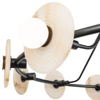Close detail of one Clérachic chandelier head, a ribbed alabaster disc with its brass socket ring and opal globe bulb.