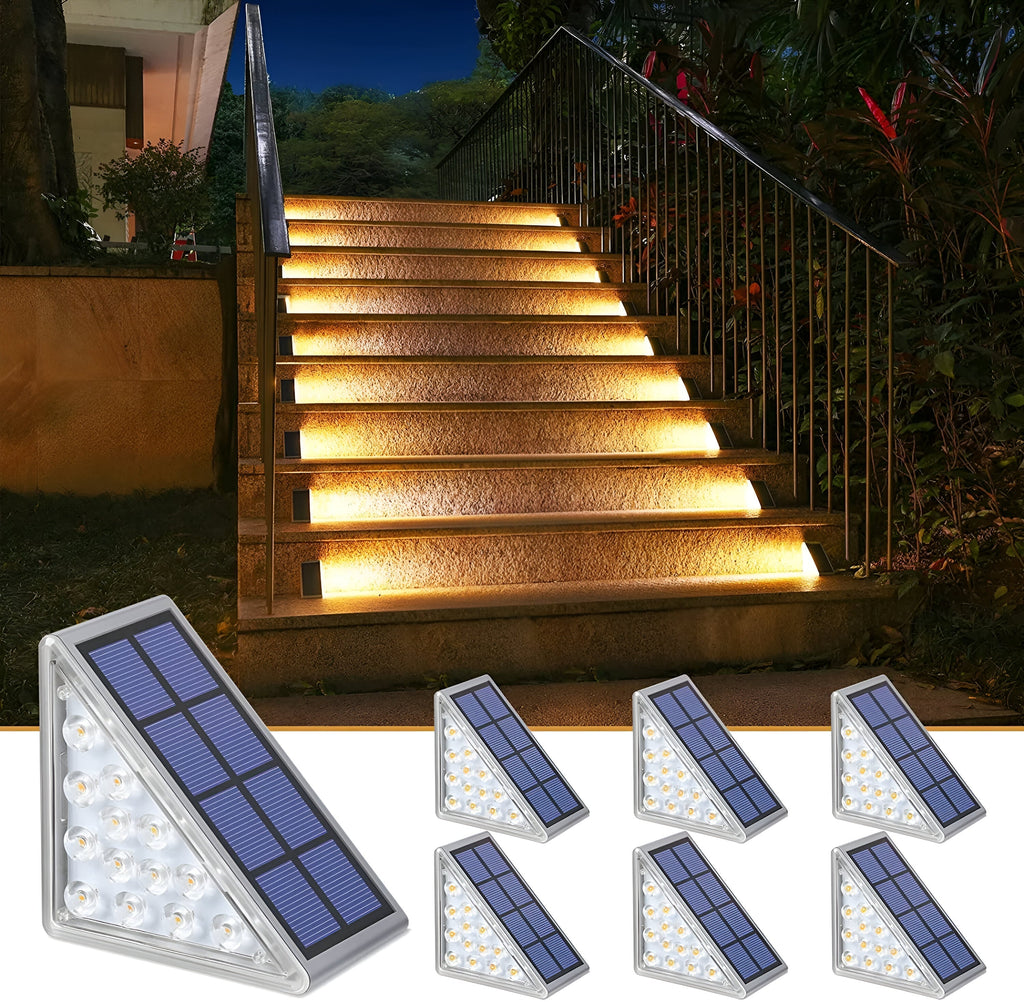 Seven Clérachic step lights shown beside a lit stone staircase in a planted garden.