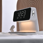 Clérachic bedside station on a pale surface, its warm underlight washing the charging pad.
